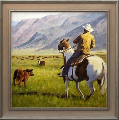 cattle round up in Eastern California. Cowboy is reuniting calf with its mother. 